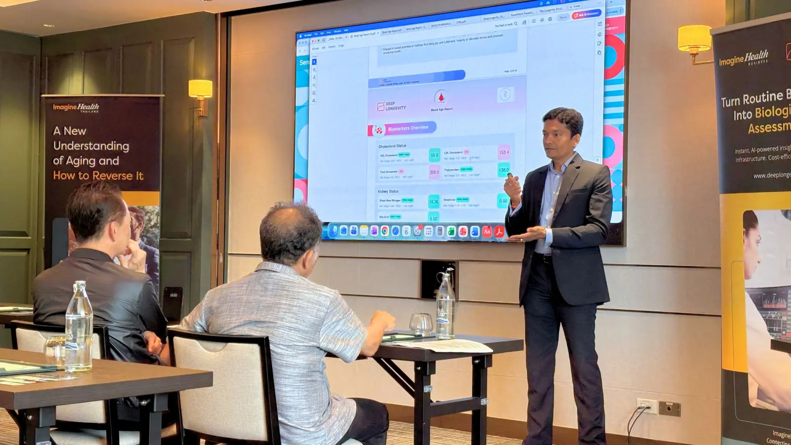 Deepankar Nayak demonstrating a biological age platform at the Millennium Hilton Bangkok