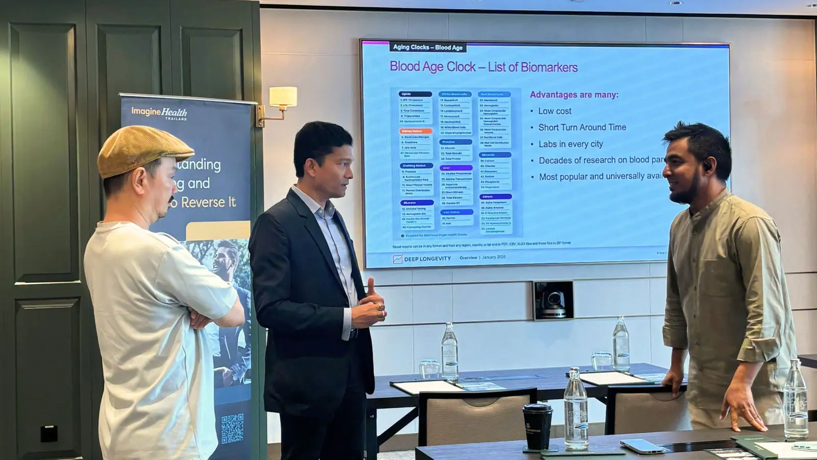 Healthcare professionals discussing blood-based aging clocks after the Bangkok seminar