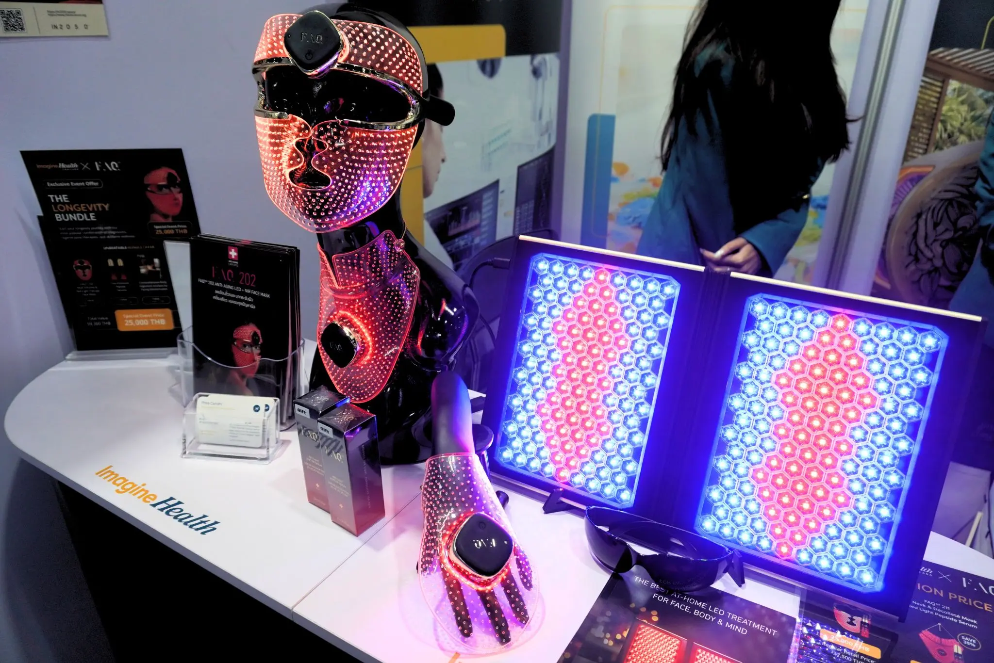 Red light therapy devices displayed at the ImagineHealth exhibition booth